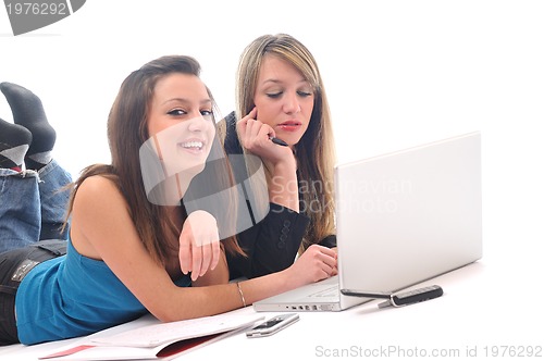 Image of two young girls work on laptop isolated