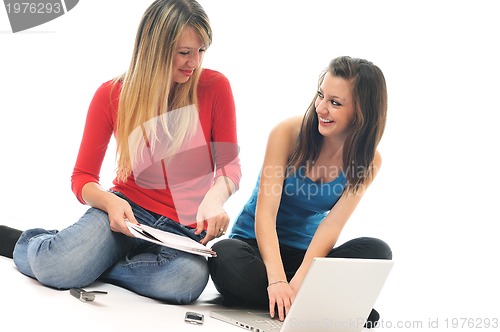 Image of two young girls work on laptop isolated