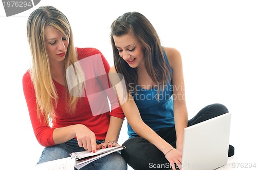 Image of two young girls work on laptop isolated