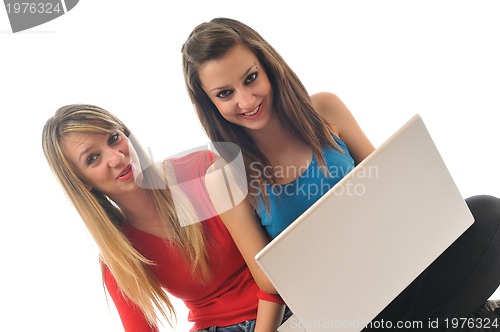 Image of two young girls work on laptop isolated