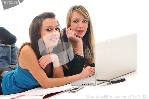 Image of two young girls work on laptop isolated