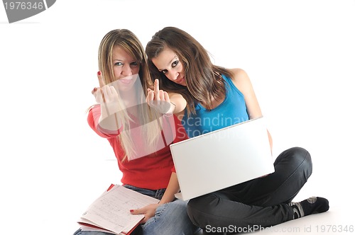 Image of two young girls work on laptop isolated