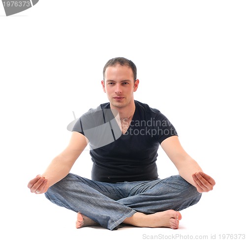 Image of young man in lotus position exercising yoga