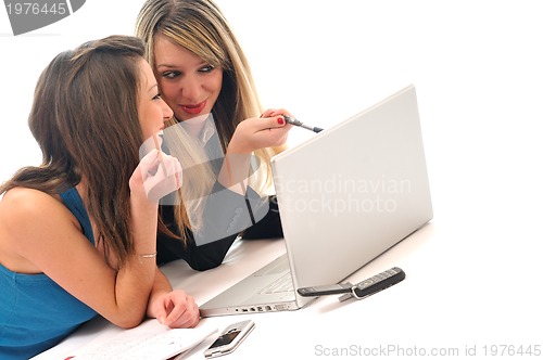 Image of two young girls work on laptop isolated