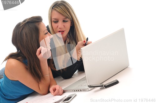 Image of two young girls work on laptop isolated