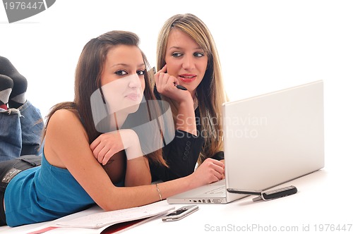 Image of two young girls work on laptop isolated