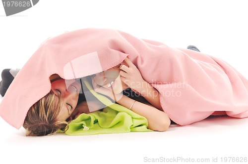 Image of young girls under blanket smile