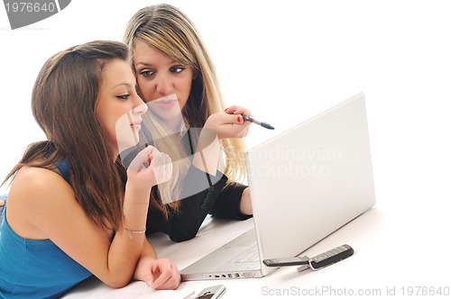 Image of two girl work on laptop