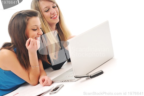 Image of two girl work on laptop