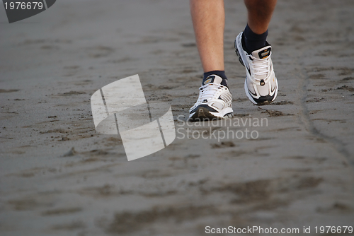 Image of man walking on beach