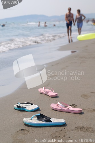 Image of sandals pair on beach