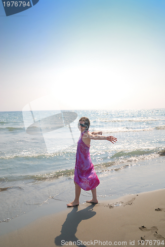 Image of happy woman on beach 