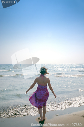 Image of happy woman on beach 