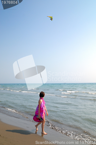 Image of happy woman on beach 