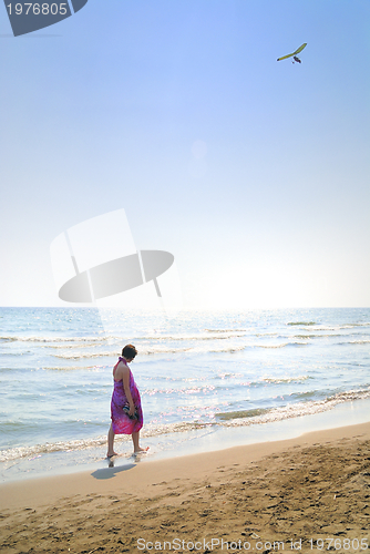 Image of happy woman on beach 