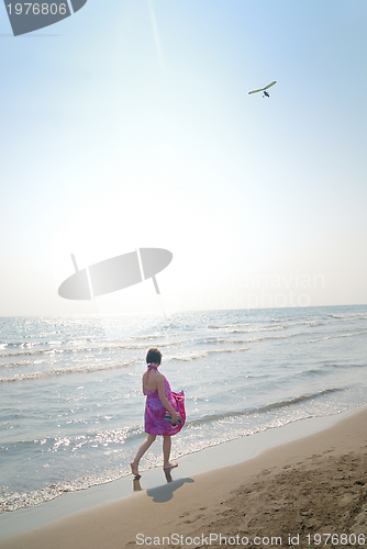 Image of happy woman on beach 