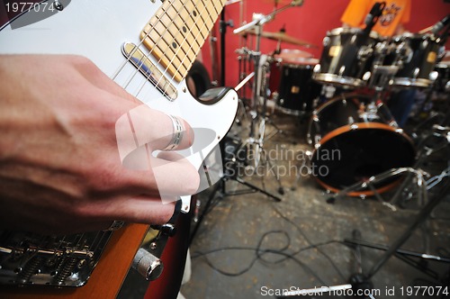 Image of music band have training in garage