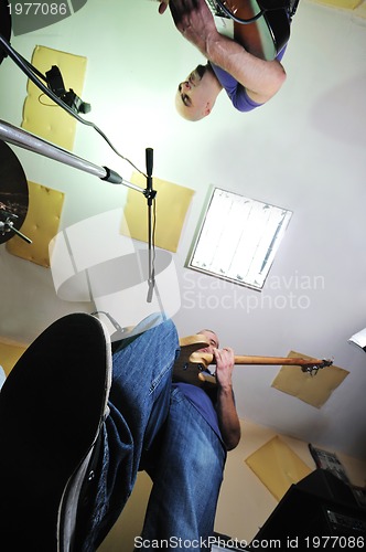 Image of music band have training in garage