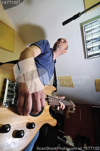 Image of music band have training in garage