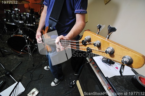 Image of music band have training in garage