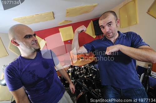 Image of music band have training in garage