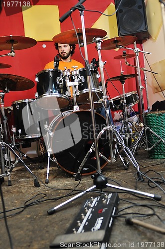 Image of music band have training in garage