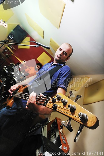 Image of music band have training in garage