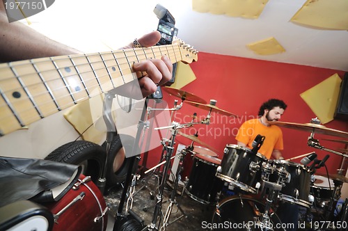 Image of music band have training in garage