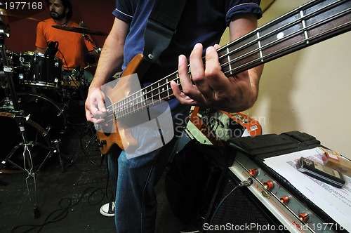 Image of music band have training in garage