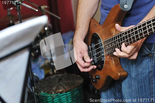 Image of music band have training in garage