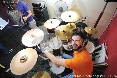 Image of music band have training in garage