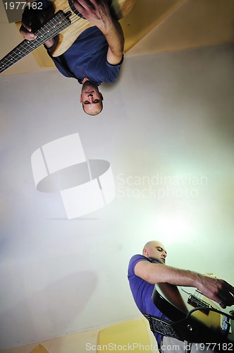 Image of music band have training in garage