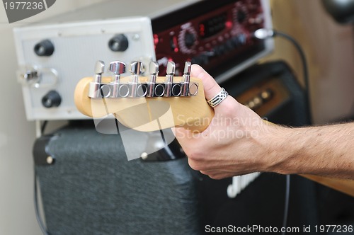 Image of music band have training in garage