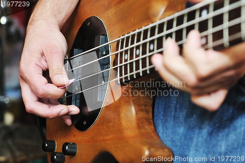 Image of music band have training in garage