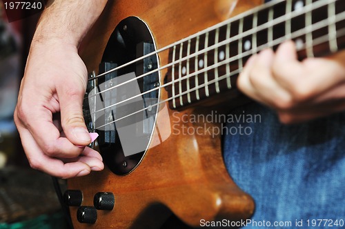 Image of music band have training in garage