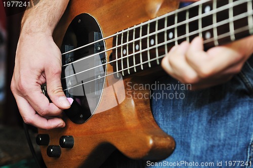 Image of music band have training in garage