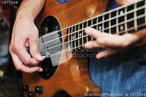 Image of music band have training in garage