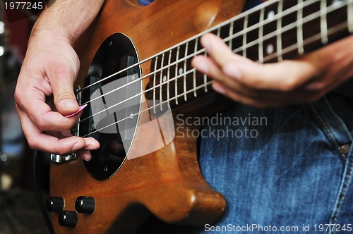 Image of music band have training in garage