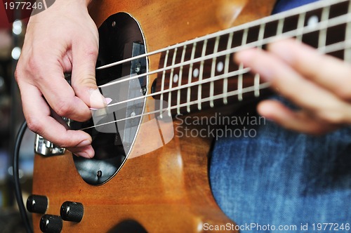 Image of music band have training in garage