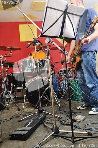 Image of music band have training in garage