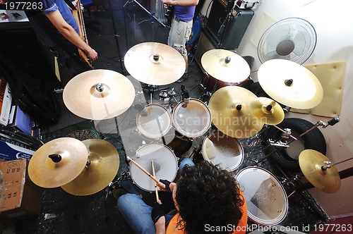 Image of music band have training in garage