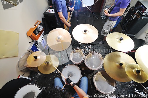 Image of music band have training in garage