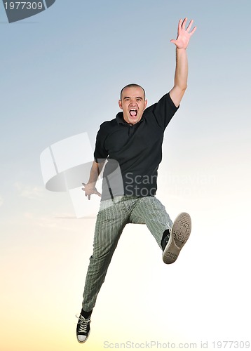 Image of man jump outdoor sunset