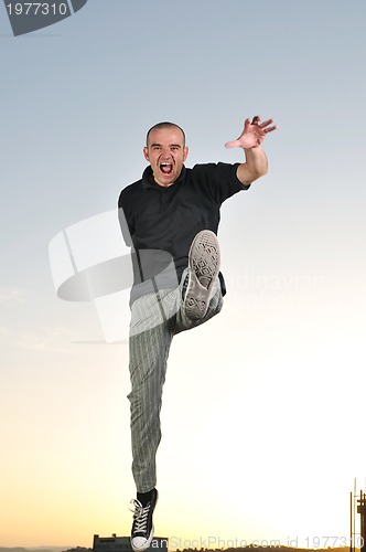 Image of man jump outdoor sunset