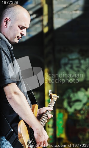 Image of music guitar player outdoor 