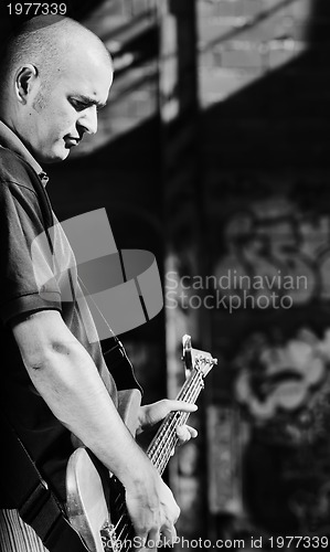 Image of music guitar player outdoor 
