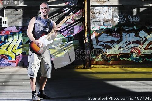 Image of music guitar player outdoor 