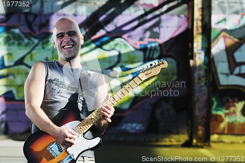 Image of music guitar player outdoor 