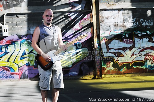 Image of music guitar player outdoor 