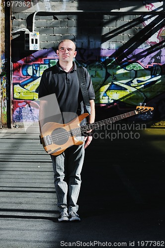 Image of music guitar player outdoor 